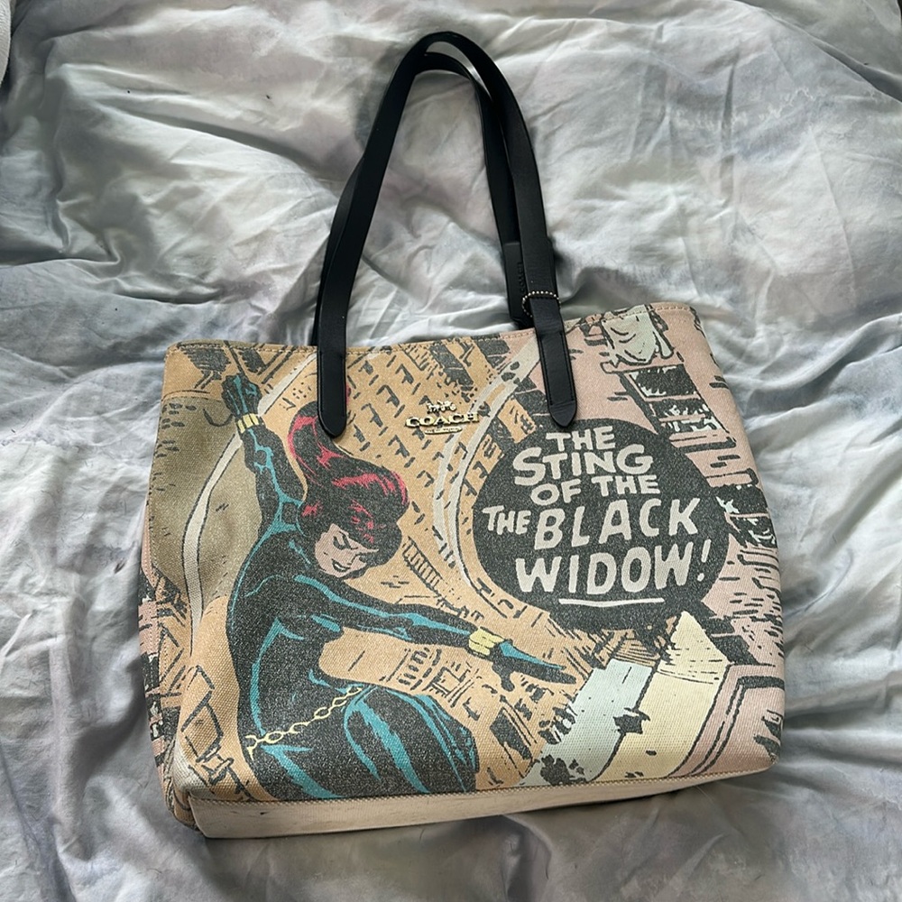 Fun coach tote. The Black Widow. Just one spot on bottom. Good used bag.